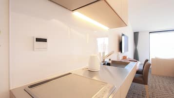 Fridge, microwave, electric kettle, cookware/dishes/utensils