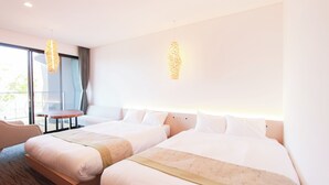A hotel room with two beds, a small table, and a chair. - HOTEL DO-YA BEPPU (Beppu)