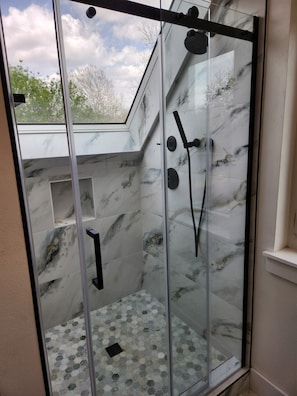 Shower, hair dryer, towels, soap