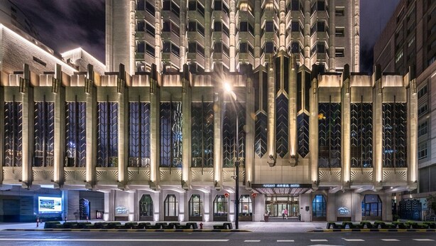 A modern hotel with a symmetrical facade, large windows, and a prominent entrance. - Elegant International Hotel Shanghai - Bund Sichuan Road North Metro Station Branch (Shanghai)