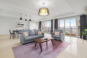 Apartment, 4 Bedrooms, City View | Living area | Flat-screen TV