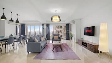 Apartment, 4 Bedrooms, City View | Living area | Flat-screen TV