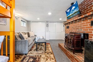 Smart TV, fireplace, table football, books