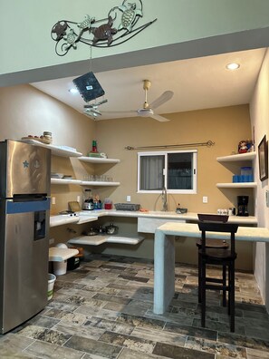 Microwave, coffee/tea maker, blender, cookware/dishes/utensils