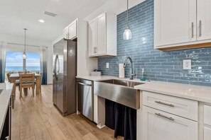Enjoy ocean views from the kitchen window, where you can cook and dine with ease.