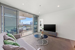 Three Bedroom Two Bathroom Compact Gabba View Apartment | Living area | Smart TV