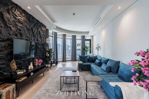 Superior Apartment, City View | Living area | 55-inch Smart TV with satellite channels - Downtown Dubai | Walk to Dubai Mall + Burj Views (Dubai)