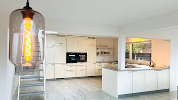 Dishwasher, coffee/tea maker, cookware/dishes/utensils