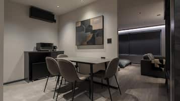 Enjoy a comfortable stay in this stylish room featuring a dining area, kitchenette, and cozy seating space.