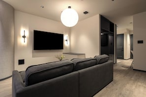Family Quadruple Room, Multiple Beds, Non Smoking | Living area | 62-inch Smart TV with digital channels
