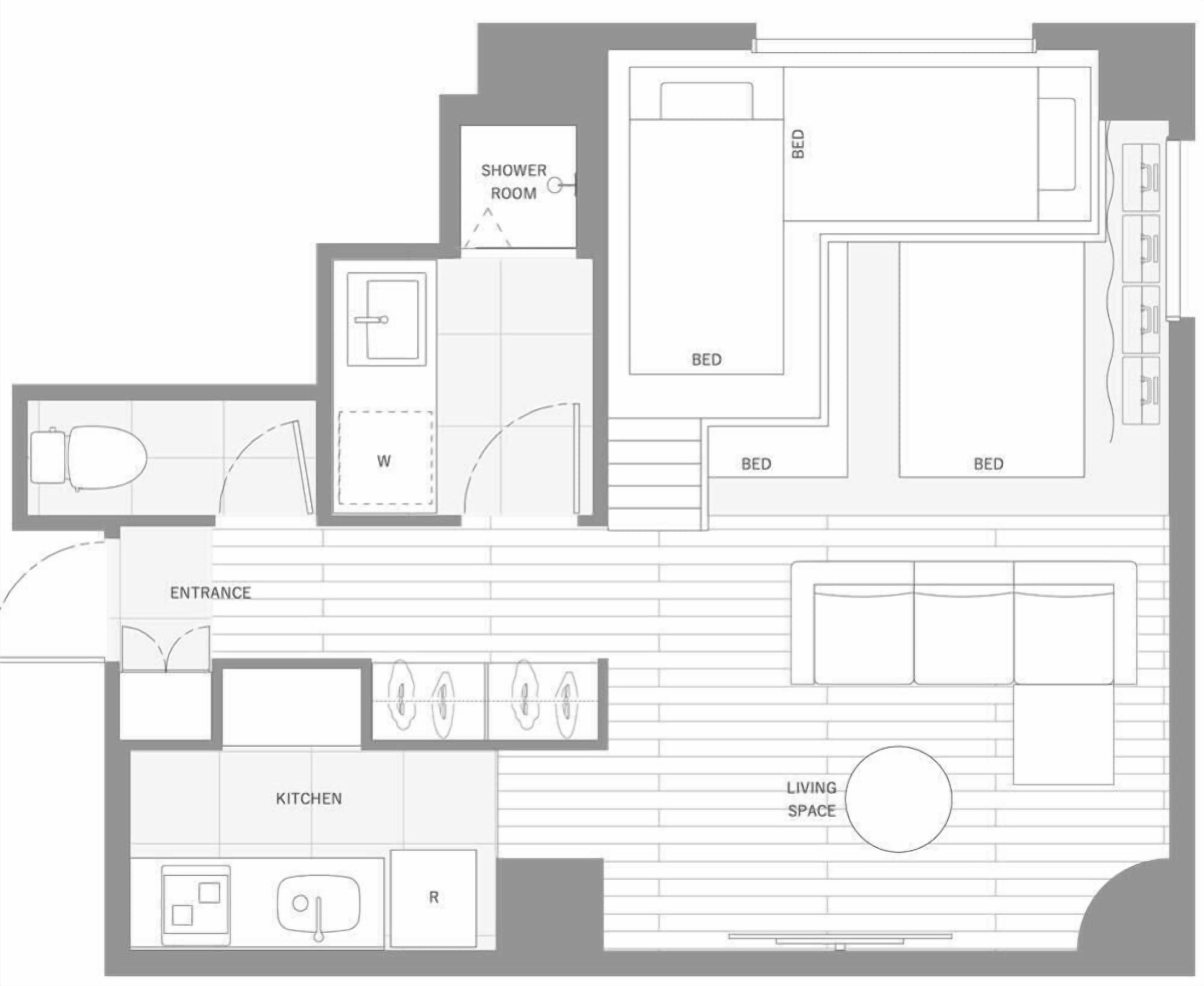 Un plan d’étage comprenant une cuisine, un espace de vie, deux chambres, une salle de bain et une entrée.