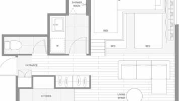 Un plan d’étage comprenant une cuisine, un espace de vie, deux chambres, une salle de bain et une entrée.