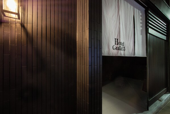 A building facade with a sign reading 'Hotel Guild 5.' - Hotel Guild 5 (Tokyo)