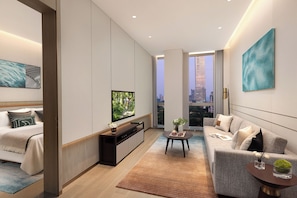 Suite exécutive, 1 chambre | Aire de séjour | Téléviseur à DEL de 50 po avec télévision par cùble