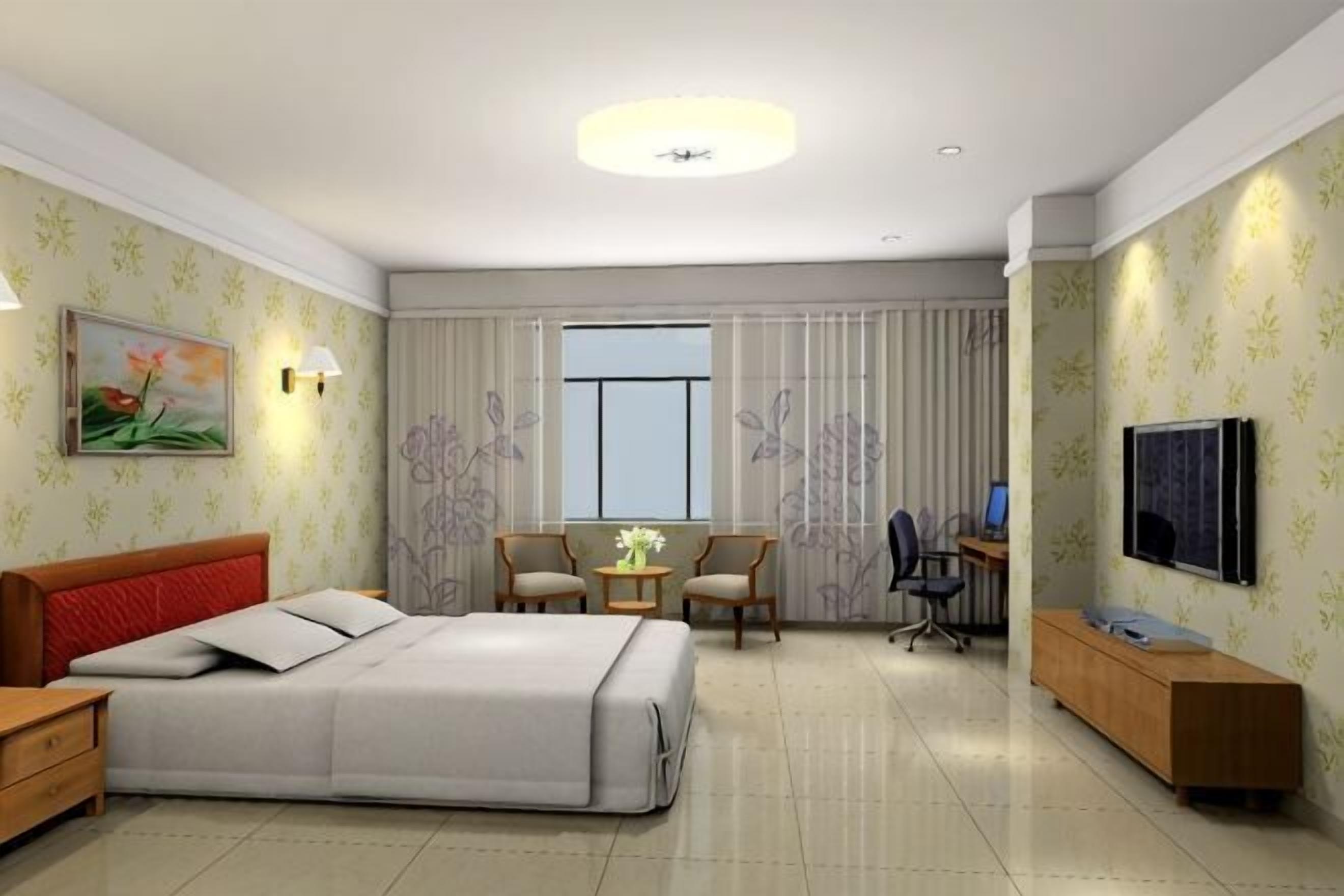 A hotel room with a bed, a desk, a chair, a TV, and a window.