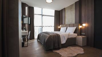 Luxury Room, City View | In-room safe, desk, laptop workspace, blackout drapes