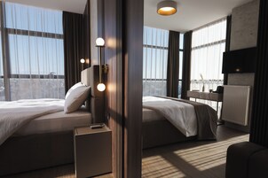 Deluxe Room, City View | In-room safe, desk, laptop workspace, blackout drapes