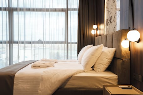 Superior Room, City View | 1 bedroom, in-room safe, desk, blackout drapes