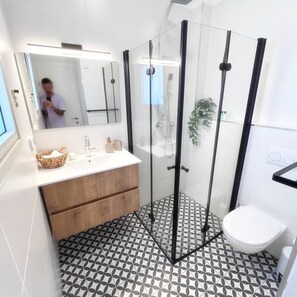 Shower, hair dryer, towels, soap