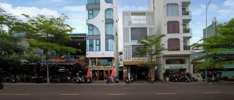 A modern building with a restaurant named "An House" on the ground floor.