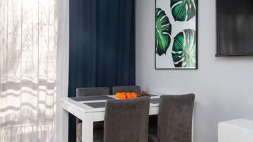 Comfort Apartment, Balcony, City View | Living area | 50-inch Smart TV with digital channels, Netflix, streaming services