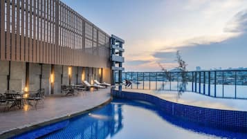 Outdoor pool, open 6:00 AM to 6:00 PM, pool loungers