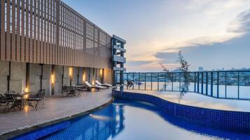 Outdoor pool, open 6:00 AM to 6:00 PM, pool loungers