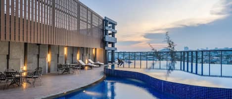 Outdoor pool, open 6:00 AM to 6:00 PM, pool loungers