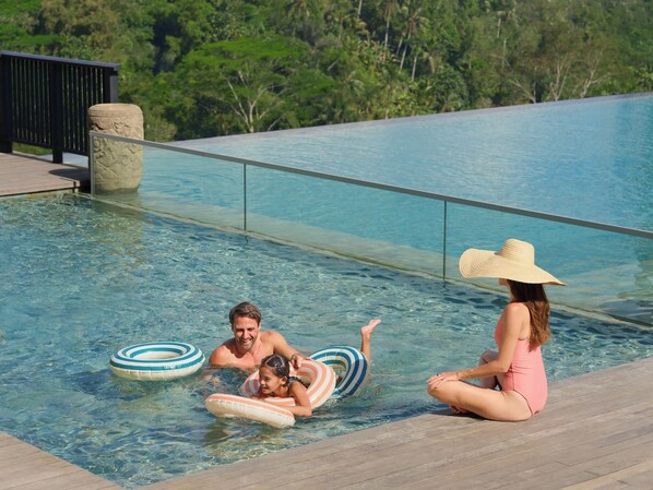 2 outdoor pools, open 7:00 AM to 6:00 PM, pool loungers