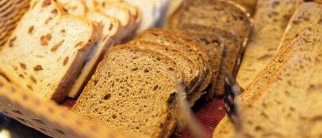 A basket of sliced bread on a table.