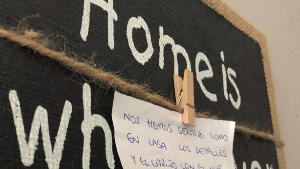 A blackboard with white text saying "Home is where I am with" and a handwritten note attached. - TAK Boutique Marbella Old Town with Parking (Marbella)