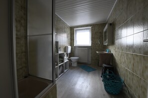 Shower, towels, soap, toilet paper