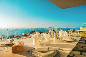 Enjoy a formal dining experience with a breathtaking view of the ocean and distant mountains.