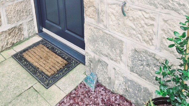 A stone building with a dark blue door, a number '3' sign above the door, and a doormat with a sign reading 'The Beaches'. - The Beaches, beachfront 2 bed home with seaviews in Banff Aberdeenshire (Banff)