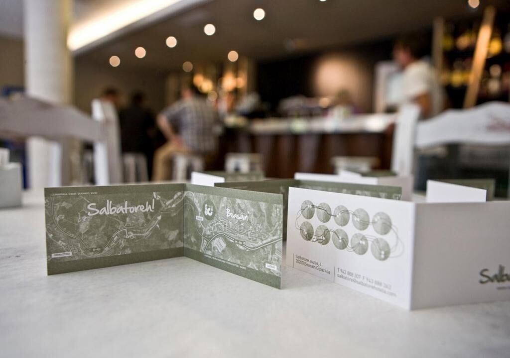 A display of Salvatore Ferragamo sunglasses boxes in a retail setting.