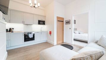 Deluxe Studio, 1 Double Bed | Private kitchen | Full-size fridge, microwave, oven, stovetop