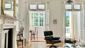 Deluxe Suite, City View | Living area | Flat-screen TV