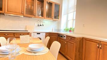 Comfort Apartment | Private kitchen | Full-size fridge, microwave, oven, stovetop
