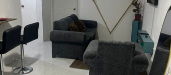 Charming 3-bedroom apartment in enchanting St. Andrew Parish with AC, WiFi.