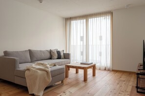 Comfort Apartment, Balcony | Living area | Heated floors - Speluca Brauerei & Genusshotel (Rheinwald)
