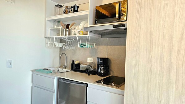Fridge, coffee/tea maker, cookware/dishes/utensils