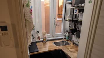 Monolocale Classic | Cucina privata | Frigorifero, microonde, piano cottura, macchina per caffè espresso