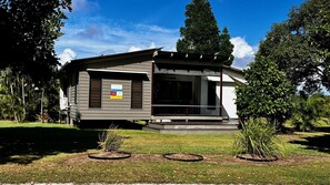 Enjoy a serene outdoor space surrounded by lush greenery and well-maintained lawns.