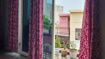 Economy Room, 3 Bedrooms | Laptop workspace, iron/ironing board, free WiFi, bed sheets