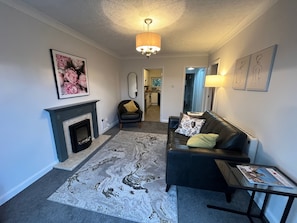 Apartment | Living area | TV, fireplace