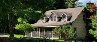 Relax and unwind - 4 bedrooms, 2 full baths, screened in porch & yard for kids.