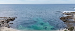 Relax on the beachfront with scenic views of the surrounding rocky outcrops and enjoy a comfortable stay.