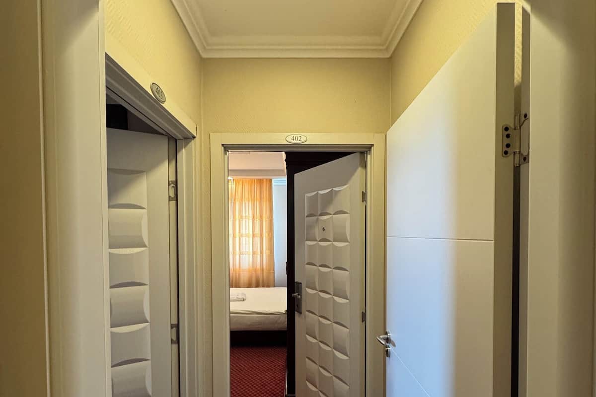Family Room, 2 Bedrooms, City View | 1 bedroom, in-room safe, desk, laptop workspace