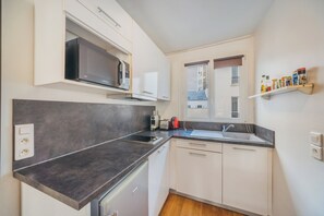 Fridge, microwave, stovetop, coffee/tea maker