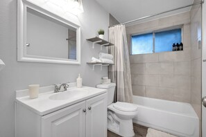 Shower, hair dryer, towels, soap